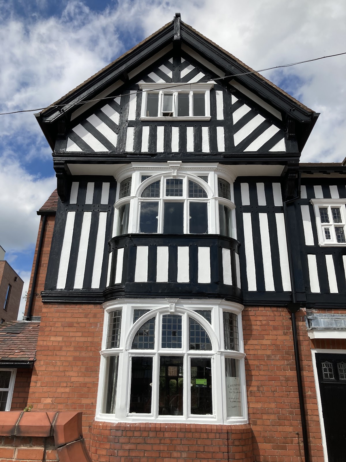 Mock-Tudor exterior with crisp black and white timber, freshly repainted by Precision Decorators